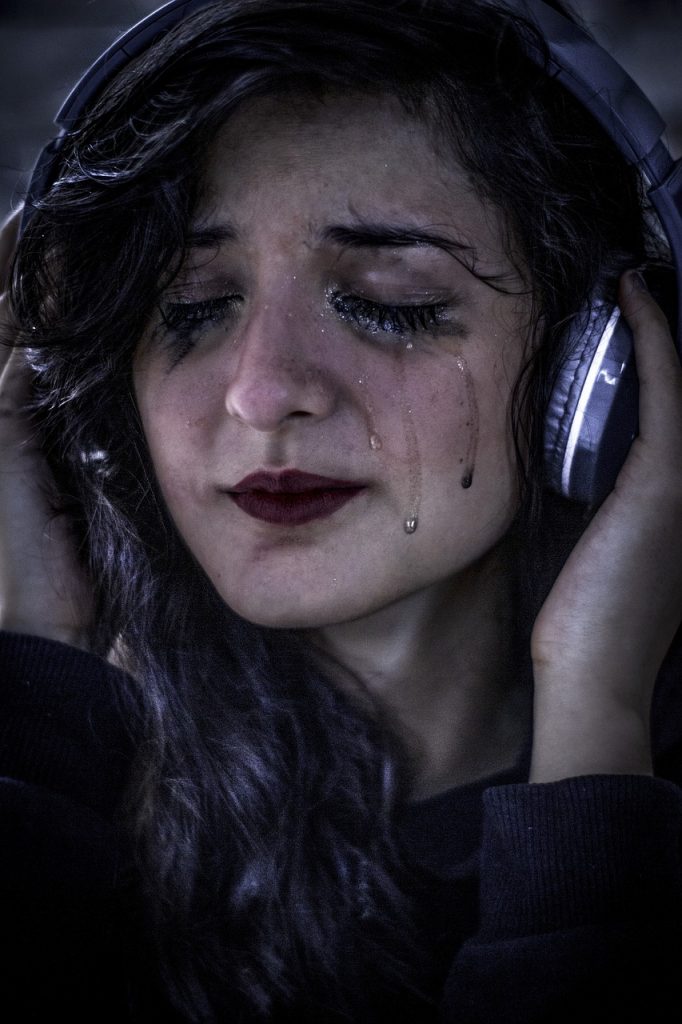 woman, tears, headphones-5725319.jpg